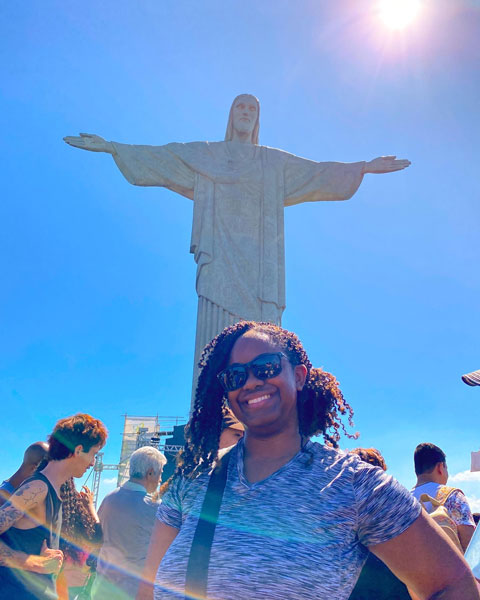 a progressive team member in front of Christ the Redeemer statue