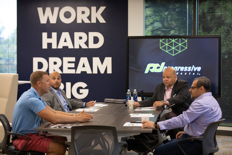 the progressive dental team during a strategy meeting