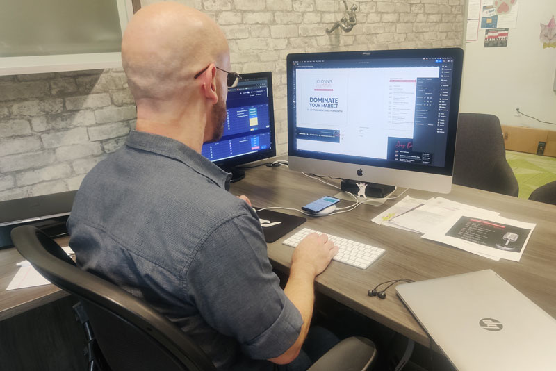 eric hod the creative director for progressive dental marketing working on branding for the closing institute in clearwater florida.
