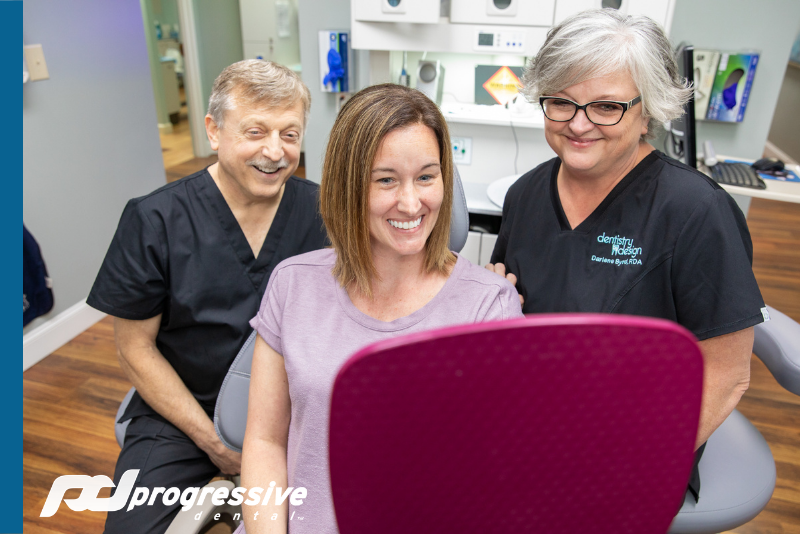 Dental Patient Having A Consultation After Being Brought To The Practice From A Dental Marketing Campaign