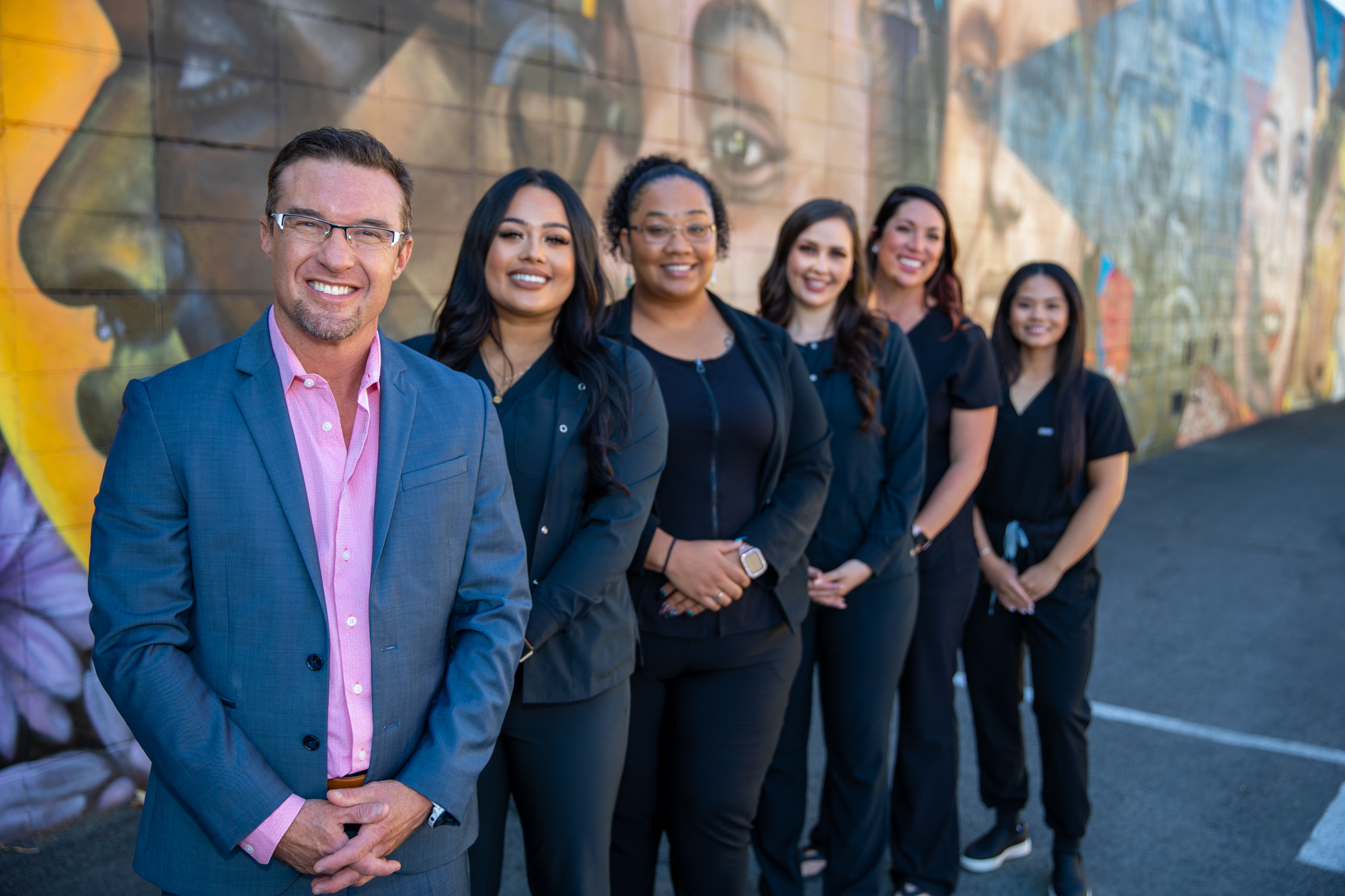 a successful dental practice staff photo|a joyful dental practice staff photo