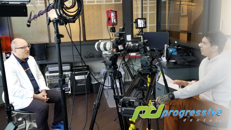 a progressive dental video team members and a dental testimonial|||a dental patient smiling during an xray procedure