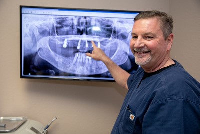 Dr Brand Infront Of An XRay