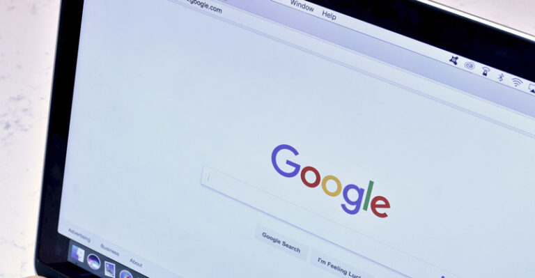 Google Search Home Screen Being Displayed On A Monitor Screen