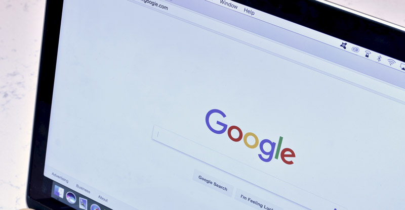 Google Search Home Screen Being Displayed On A Monitor Screen