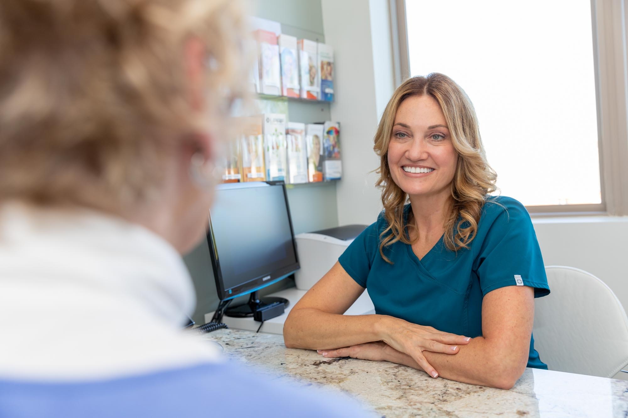 Dental Treatment Coordinator Working With A Dental Patient With A Subprime Credit Score To Finance Her Full Arch Dental Implant Procedure|Dental Patients Financing A Full Arch Dental Implant Procedure