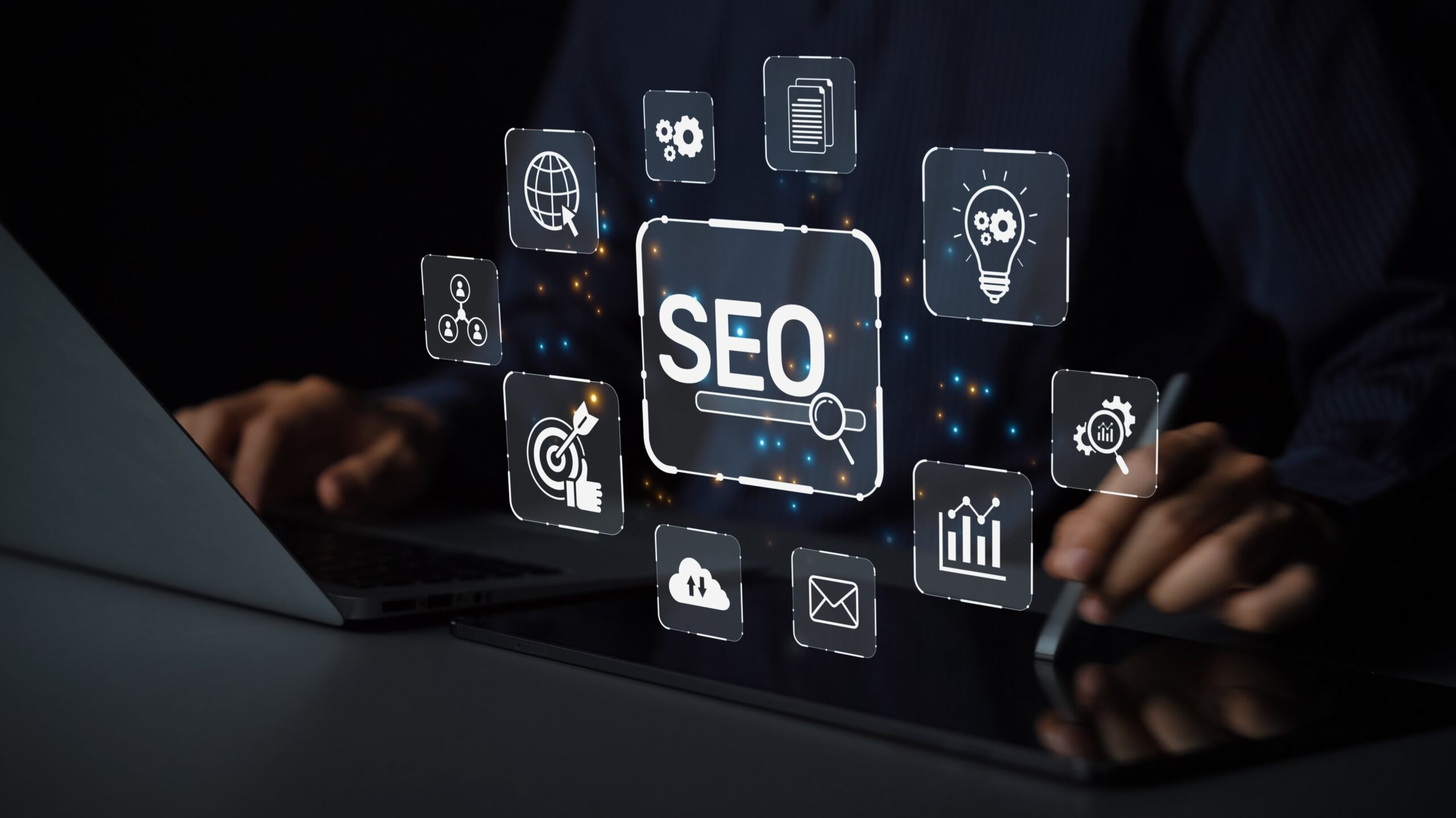 A person works at a laptop with floating icons around a bright SEO symbol: globe, document, lightbulb, target, cloud, mail, and graph—representing digital marketing and search engine optimization concepts.